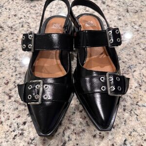 Patent black slip on dress shoe.